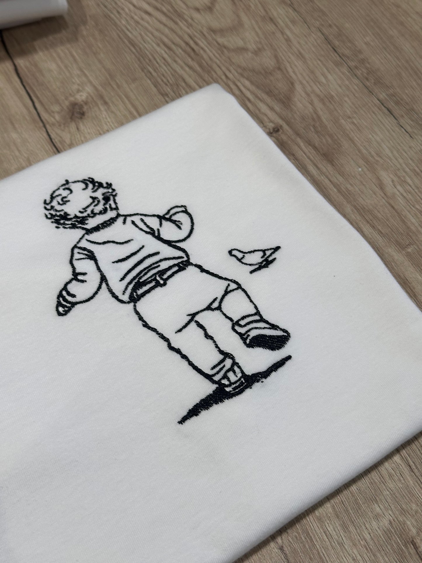 T-shirt con foto ricamata